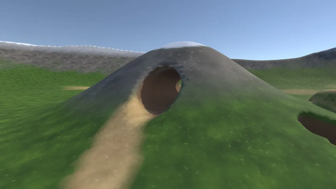 Tunnel dug through a hill, with a painted sand path